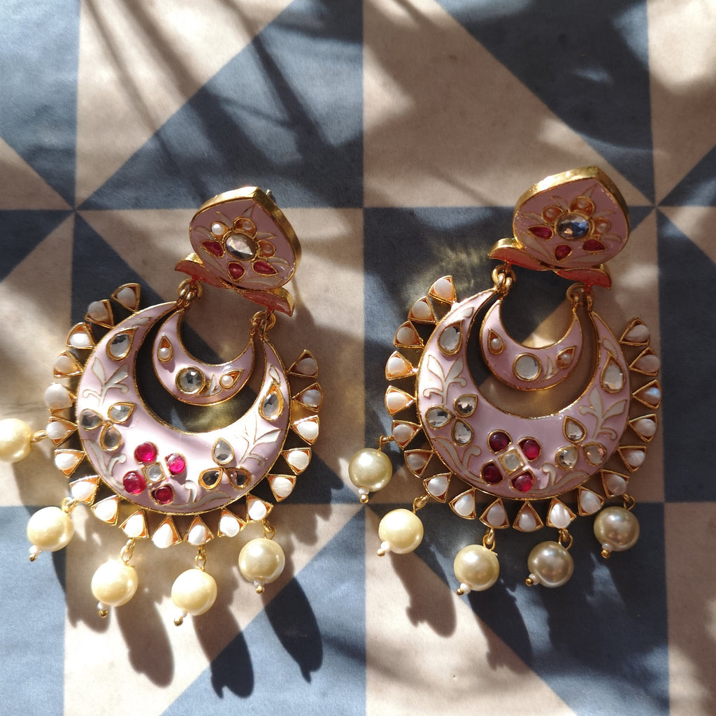 Beautiful Enamel Painted Earrings with pearl drops, set on an Antique gold plating. A must have statement piece in your collection. Available in a variety of colours.